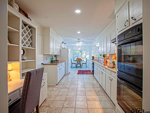 704 Wellington St, Tyler, TX 75703 - kitchen with decorative backsplash, freestanding refrigerator, a ceiling fan, recessed lighting, and white cabinetry