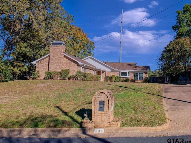 ranch-style house featuring a front lawn