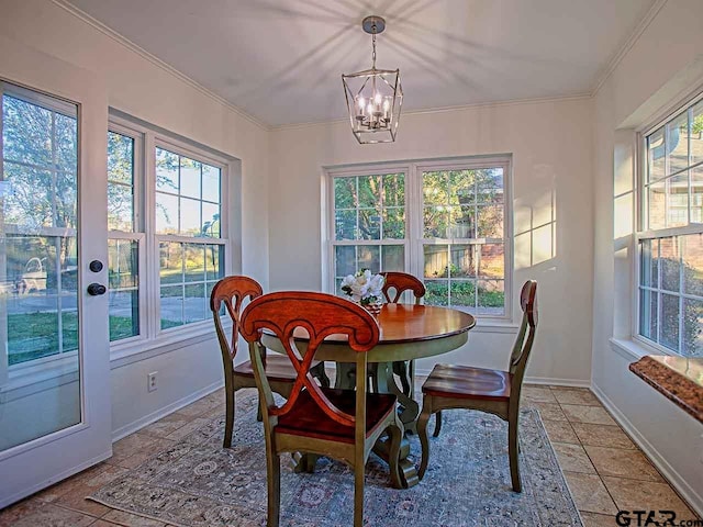704 Wellington St, Tyler, TX 75703 - dining area featuring healthy amount of natural light, a chandelier, and crown molding