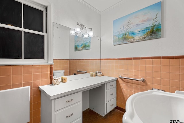 bathroom featuring toilet, tile walls, and ornamental molding