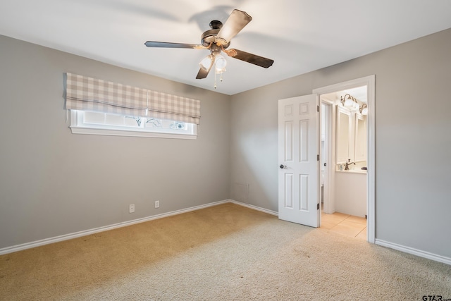 unfurnished bedroom featuring ceiling fan and light colored carpet