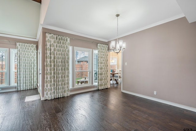 unfurnished dining area with a notable chandelier, ornamental molding, and dark hardwood / wood-style floors