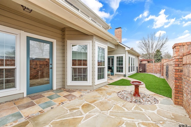 doorway to property featuring a patio