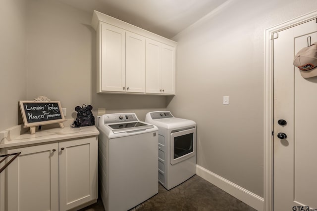 washroom with washing machine and dryer and cabinets