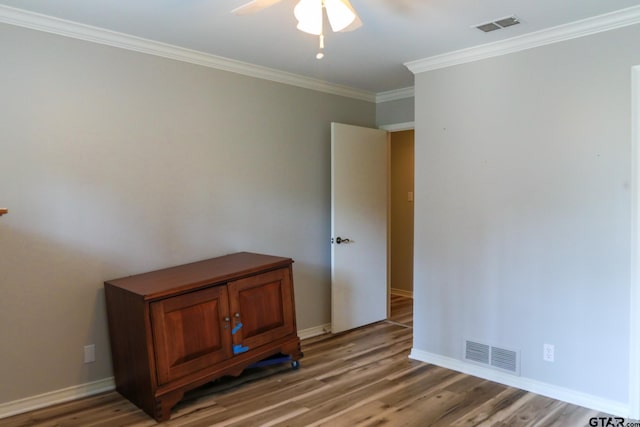 8310 Columbia Dr, Tyler, TX 75703 - spare room featuring a ceiling fan, crown molding, light wood finished floors, and baseboards