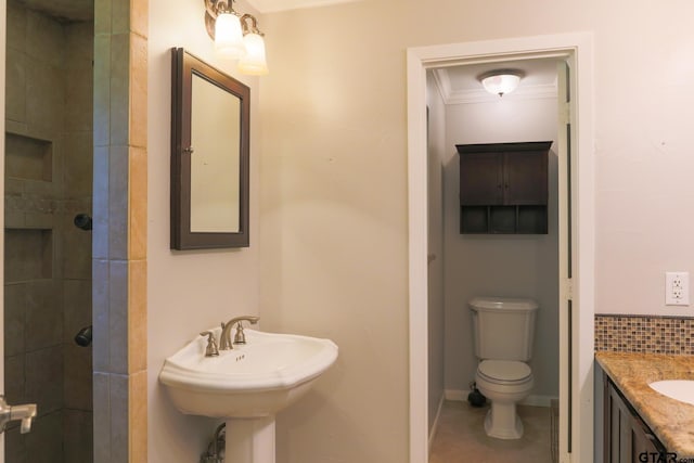 8310 Columbia Dr, Tyler, TX 75703 - full bath featuring toilet, tile patterned floors, tiled shower, and a sink
