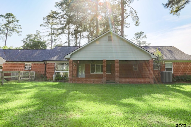 8310 Columbia Dr, Tyler, TX 75703 - rear view of house with brick siding, central air condition unit, and a shingled roof