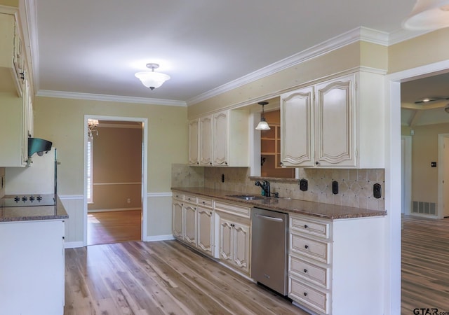 8310 Columbia Dr, Tyler, TX 75703 - kitchen featuring stainless steel dishwasher, a sink, ornamental molding, light wood-style floors, and decorative backsplash