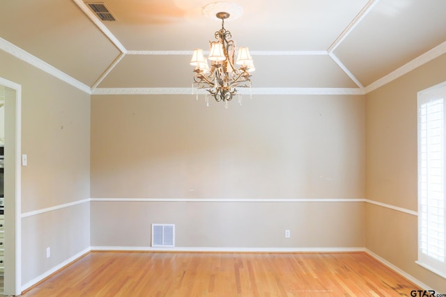 8310 Columbia Dr, Tyler, TX 75703 - unfurnished room featuring lofted ceiling, wood finished floors, a chandelier, healthy amount of natural light, and crown molding