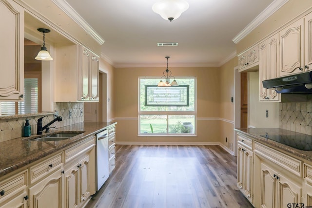 8310 Columbia Dr, Tyler, TX 75703 - kitchen featuring a sink, black electric cooktop, cream cabinetry, stainless steel dishwasher, and ornamental molding