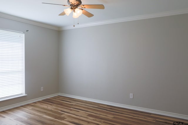 8310 Columbia Dr, Tyler, TX 75703 - spare room featuring wood finished floors, baseboards, a ceiling fan, and crown molding