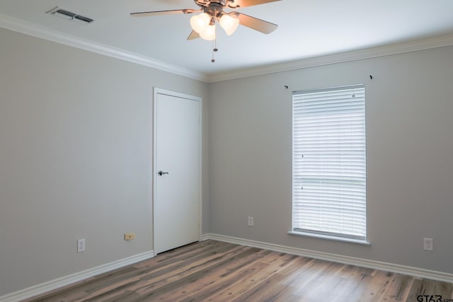 8310 Columbia Dr, Tyler, TX 75703 - unfurnished room featuring a ceiling fan, wood finished floors, crown molding, and baseboards