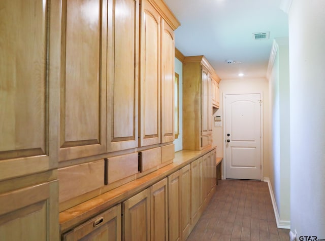 8310 Columbia Dr, Tyler, TX 75703 - hall featuring baseboards, brick patterned flooring, and crown molding