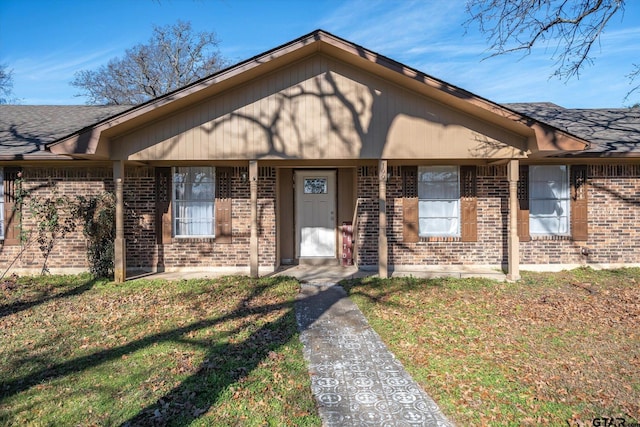 ranch-style home with a front lawn