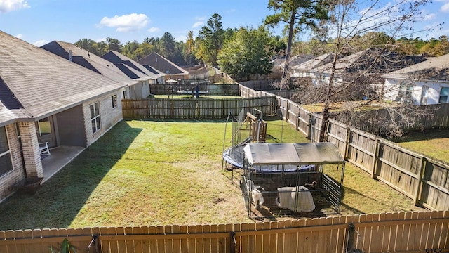 view of yard with a trampoline