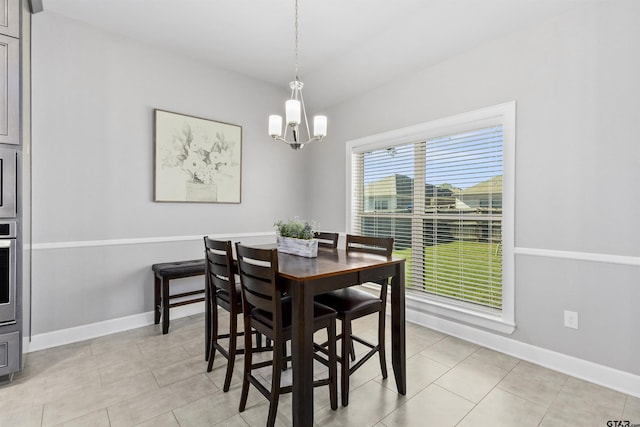 dining area featuring a chandelier