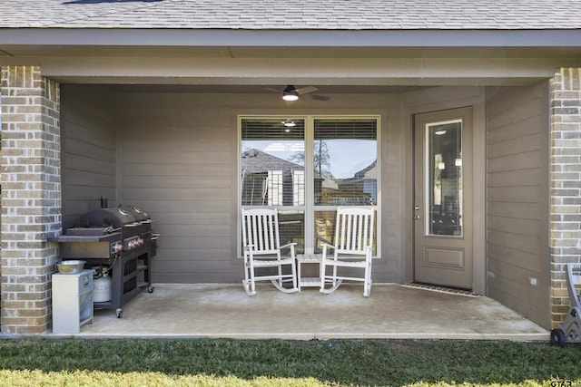 doorway to property with ceiling fan and a patio area