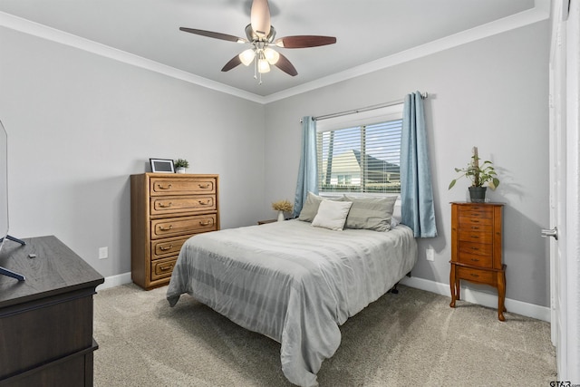 carpeted bedroom featuring ceiling fan and ornamental molding