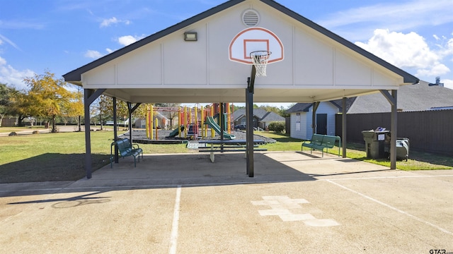 view of sport court with a playground and a yard