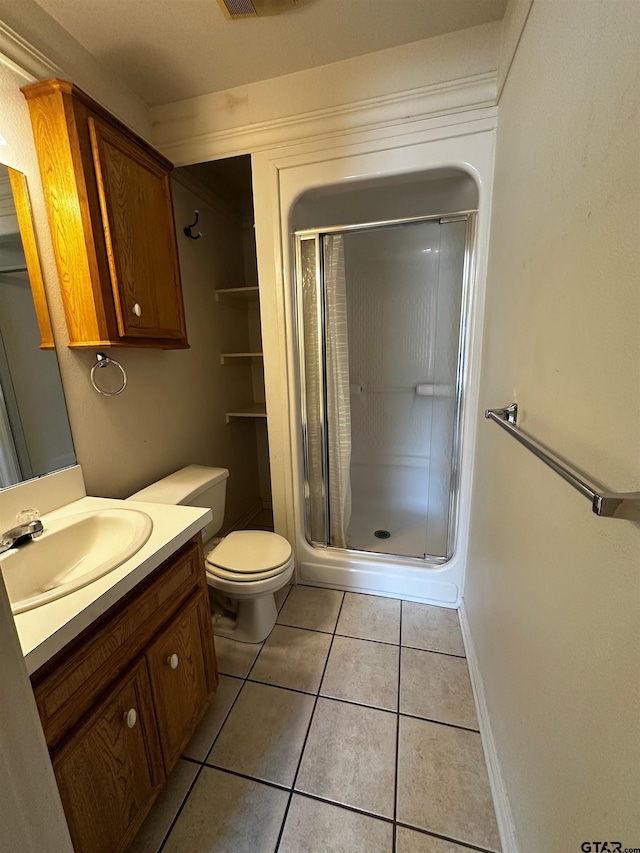 811 Windmill Ln, Athens, TX 75751 - full bath featuring vanity, a shower stall, toilet, and tile patterned flooring
