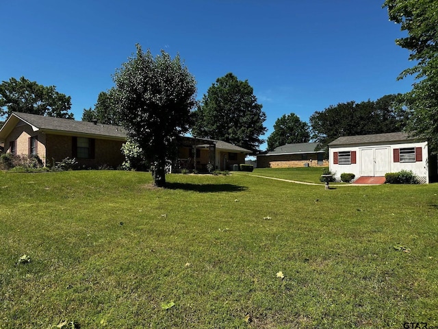 811 Windmill Ln, Athens, TX 75751 - view of green lawn featuring an outdoor structure