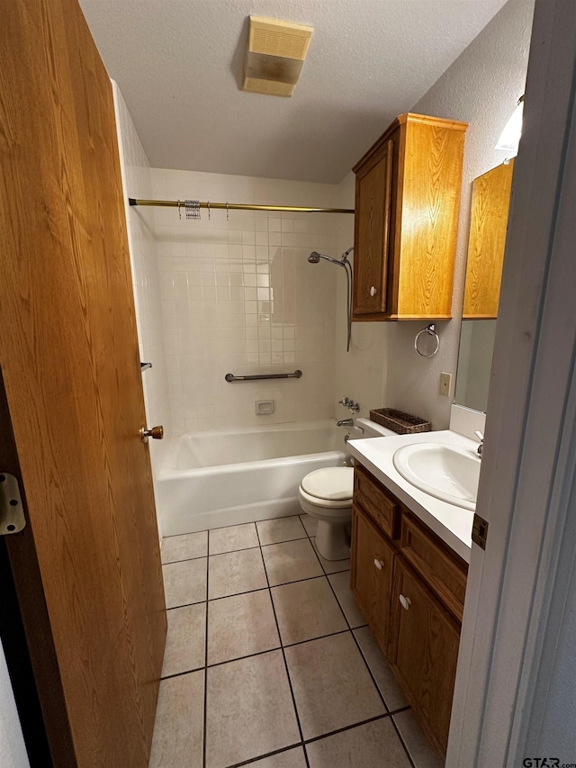 811 Windmill Ln, Athens, TX 75751 - bathroom featuring vanity, tile patterned flooring, shower / bath combination, toilet, and a textured ceiling