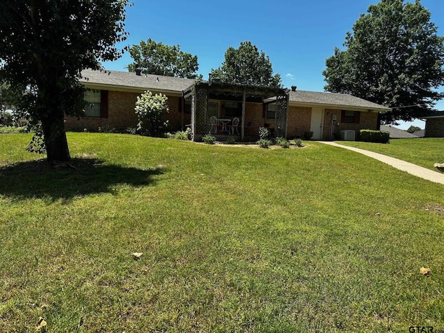 811 Windmill Ln, Athens, TX 75751 - single story home featuring a front lawn, brick siding, and cooling unit
