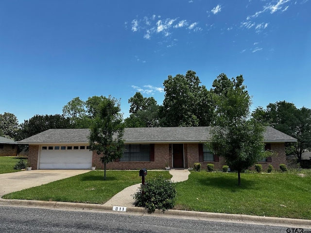 811 Windmill Ln, Athens, TX 75751 - ranch-style house featuring a garage, driveway, a front lawn, and brick siding