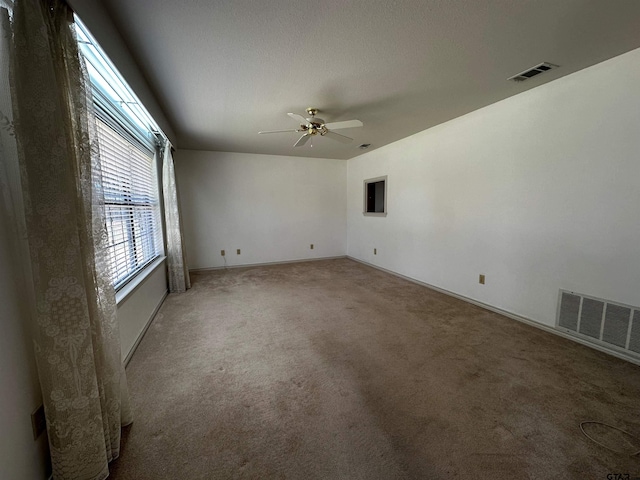 811 Windmill Ln, Athens, TX 75751 - empty room featuring light carpet, ceiling fan, and baseboards