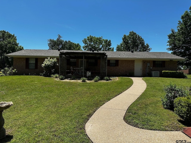 811 Windmill Ln, Athens, TX 75751 - view of front of home with a front lawn, brick siding, and central air condition unit
