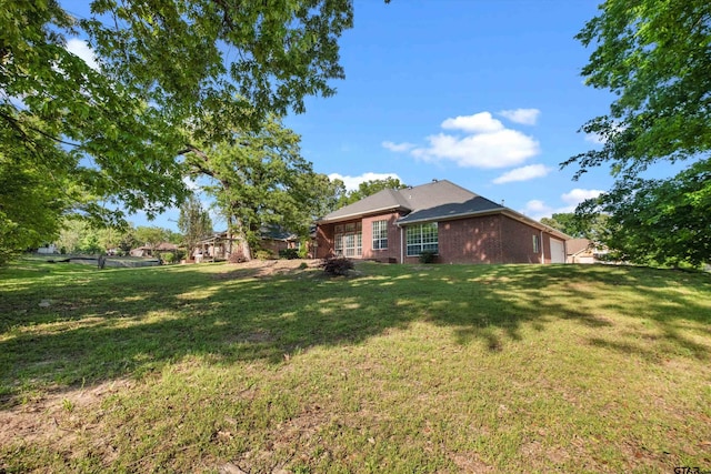 3827 Scenic Dr, Tyler, TX 75709 - view of grassy yard featuring an attached garage