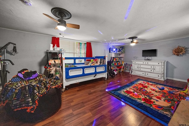 110 Utah St, Van, TX 75790 - bedroom with a textured ceiling, wood finished floors, and ceiling fan