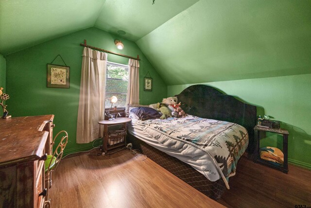 110 Utah St, Van, TX 75790 - bedroom with wood finished floors and vaulted ceiling