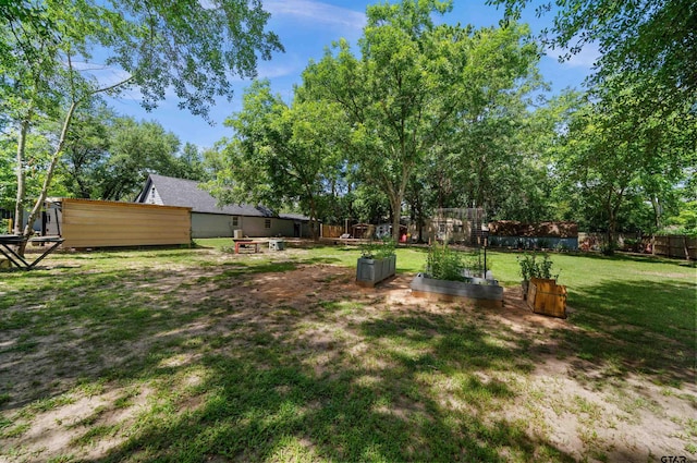110 Utah St, Van, TX 75790 - fenced backyard featuring a garden
