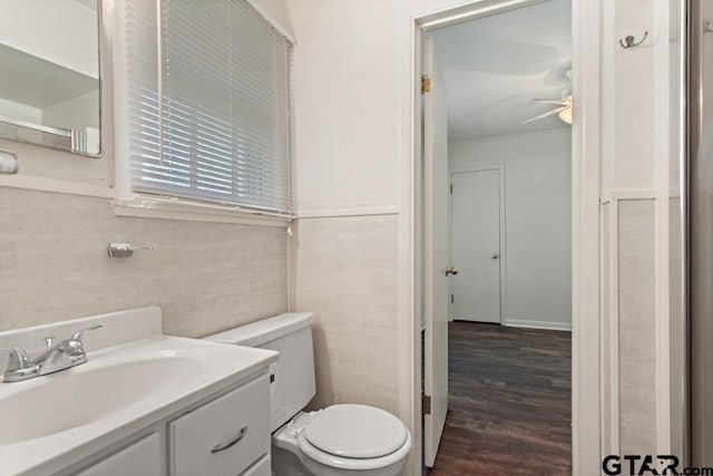 1209 E 8th St, Tyler, TX 75701 - bathroom featuring vanity, wood finished floors, and ceiling fan