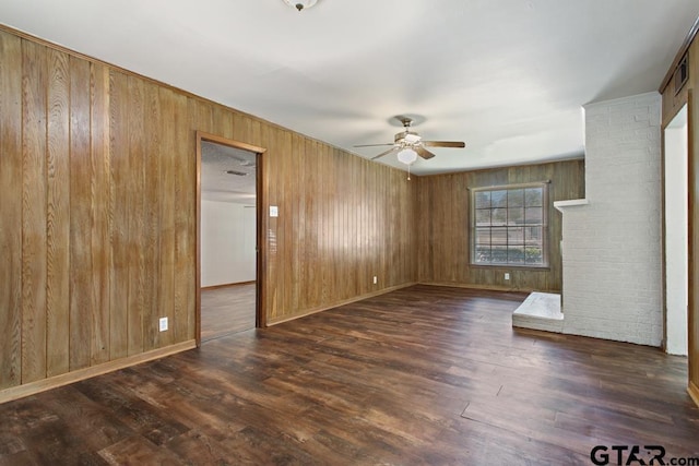 1209 E 8th St, Tyler, TX 75701 - unfurnished room with a ceiling fan, wood walls, and wood finished floors