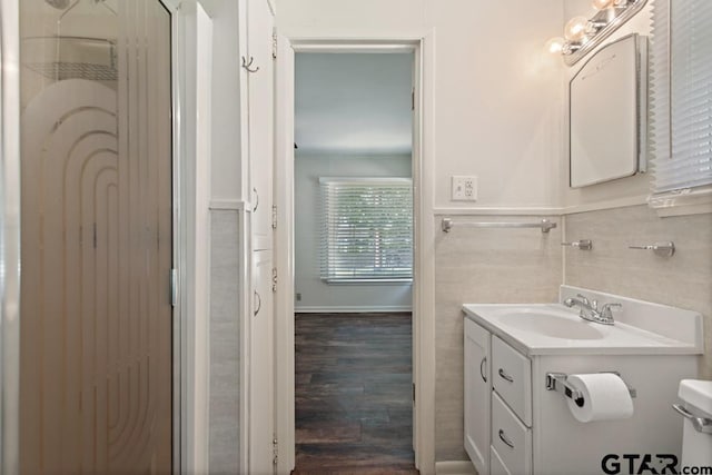 1209 E 8th St, Tyler, TX 75701 - bathroom with vanity and wood finished floors