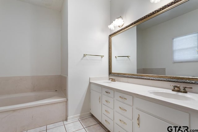 1209 E 8th St, Tyler, TX 75701 - bathroom with double vanity, a garden tub, and tile patterned floors