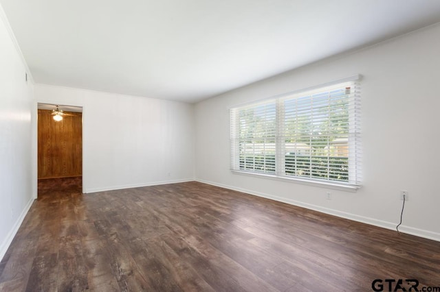 1209 E 8th St, Tyler, TX 75701 - spare room featuring dark wood finished floors and baseboards