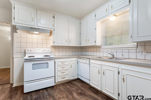 1209 E 8th St, Tyler, TX 75701 - kitchen featuring white appliances, under cabinet range hood, light countertops, dark wood-type flooring, and white cabinets