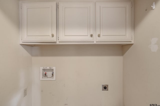 laundry room featuring hookup for a washing machine, cabinet space, and electric dryer hookup