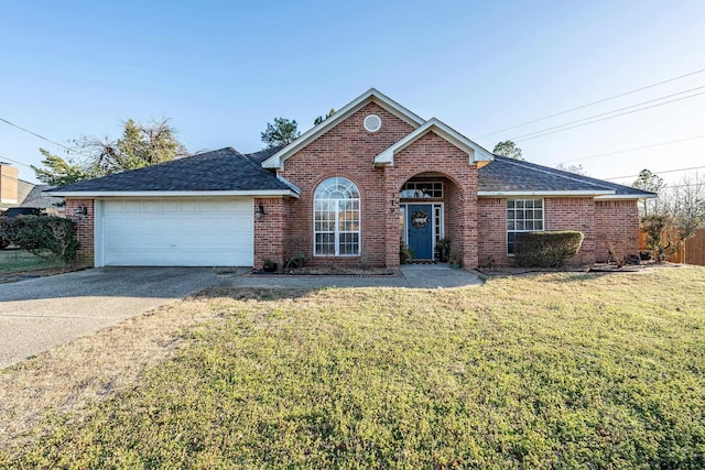 view of front of home with brick siding, driveway, and a front lawn