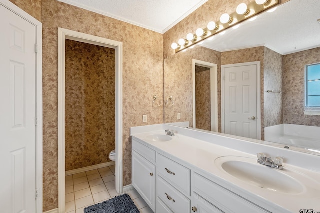 bathroom with a textured ceiling, a sink, and wallpapered walls