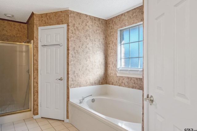 bathroom with a textured ceiling, a shower stall, a bath, and wallpapered walls