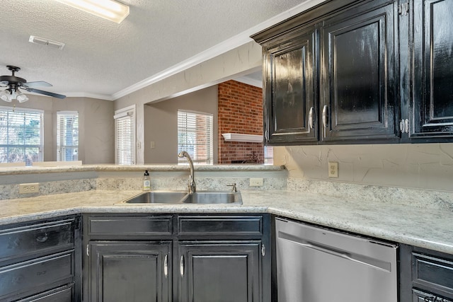 kitchen featuring a sink, visible vents, a healthy amount of sunlight, dishwasher, and crown molding