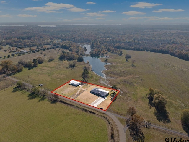 drone / aerial view featuring a rural view and a water view