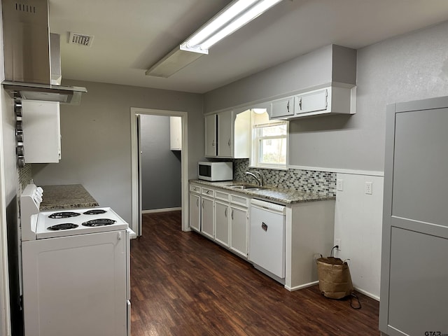 kitchen with white appliances, exhaust hood, white cabinetry, dark hardwood / wood-style flooring, and sink