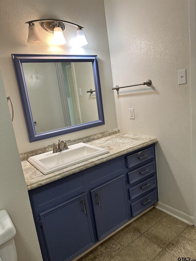 bathroom with vanity and tile patterned floors