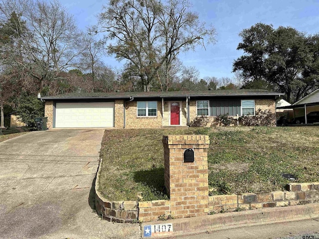 ranch-style home with a front lawn and a garage