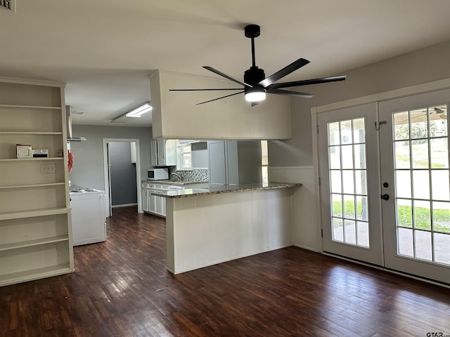 kitchen with light stone countertops, white cabinetry, french doors, kitchen peninsula, and ceiling fan